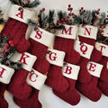 Chaussette de Noël neuve en tricot avec monogramme et lettres rouges
